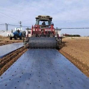 Film laying and punching machine