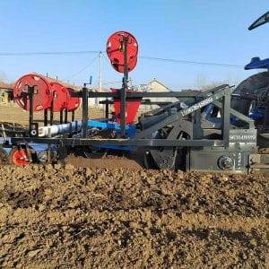Rotary tillage ridging film laying machine